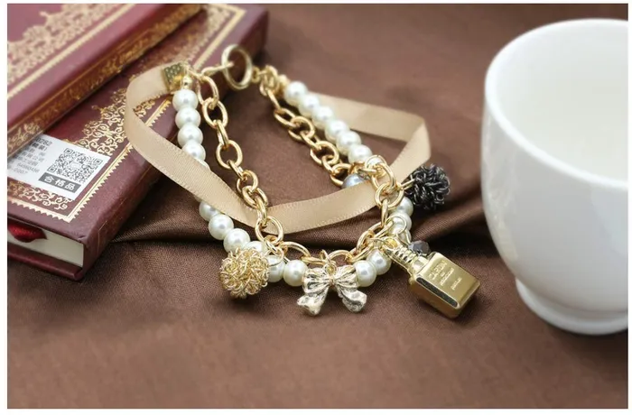Yellow Chimes Bracelets Yellow Chimes Exclusive Stylish Bowknot Multilayer Pearl Gold Plated Charm Bracelet for Women and Girls
