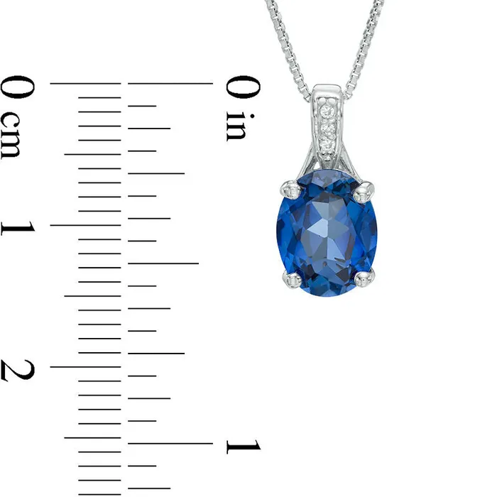 Oval LabCreated Blue Sapphire and Diamond Accent Pendant in Sterling Silver Goldia Necklaces Oval LabCreated Blue Sapphire and Diamond Accent Pendant in Sterling Silver Goldia Necklaces